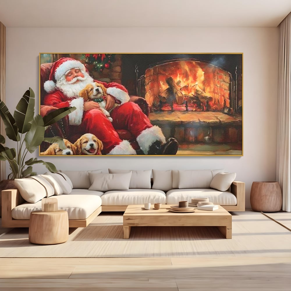 Tablou canvas cu mos craciun dormind cu catei langa semineu, in rama de aluminiu auriu, pe perete intr-un living